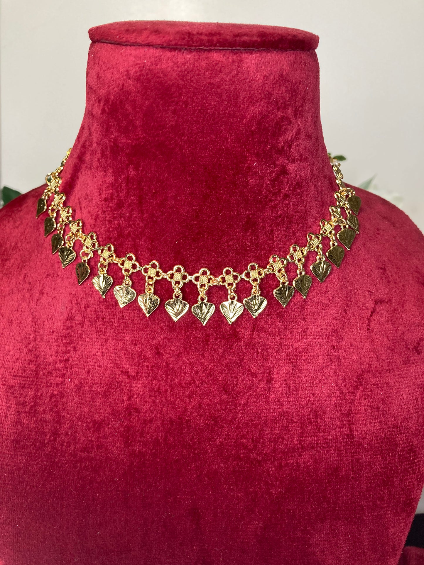 Gold tone beautiful necklace set with earrings and tikka