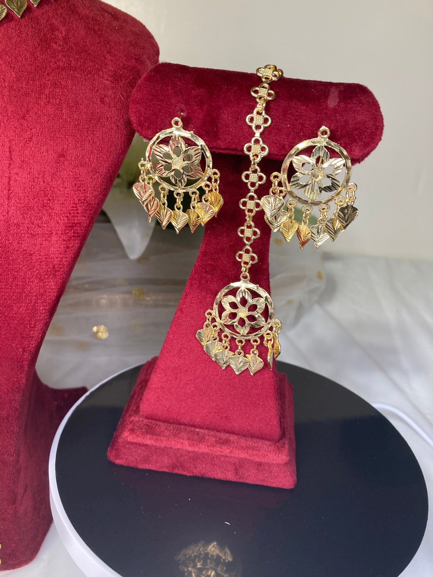 Gold tone beautiful necklace set with earrings and tikka